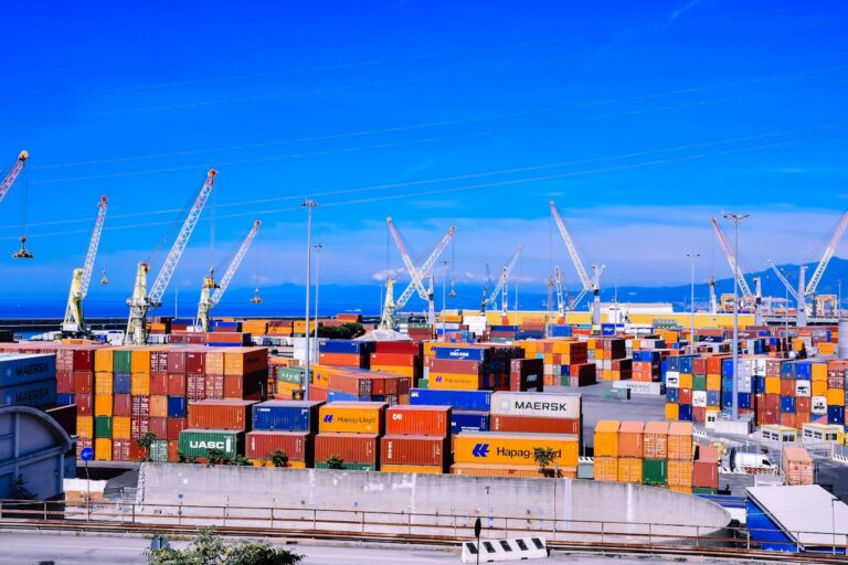 Shipping containers and cranes at a commercial port for sea freight and global logistics