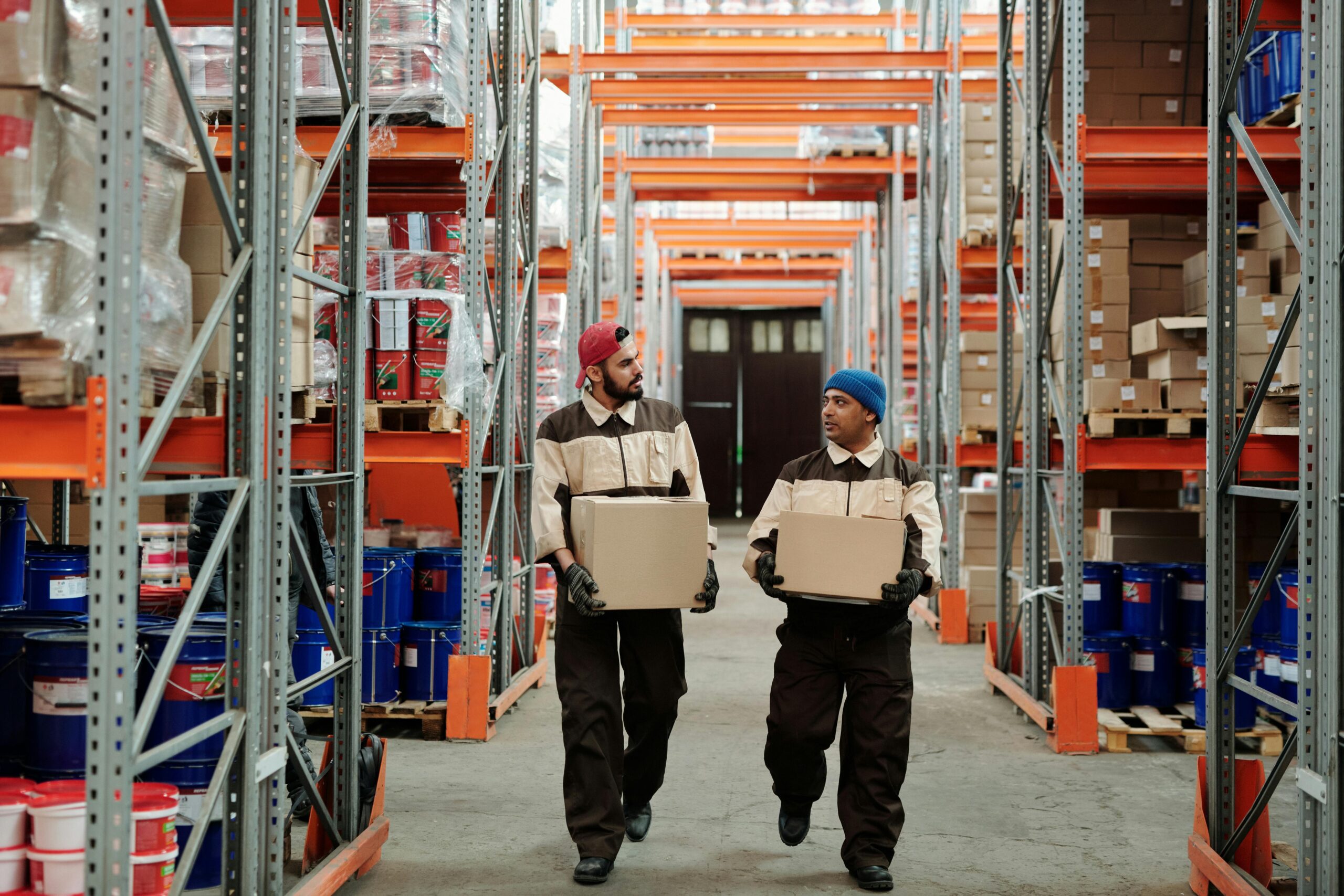 warehouse workers carrying cartons for export repacking and shipping preparation